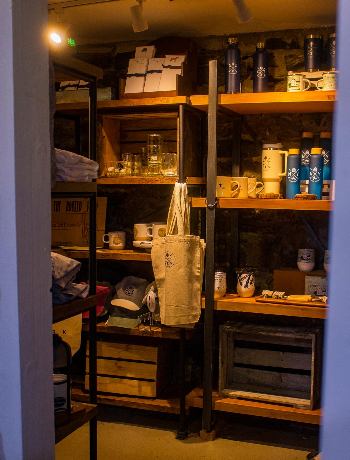 Local merchandise, drinkware, tote bags, and gifts displayed inside The Market at Union Hall