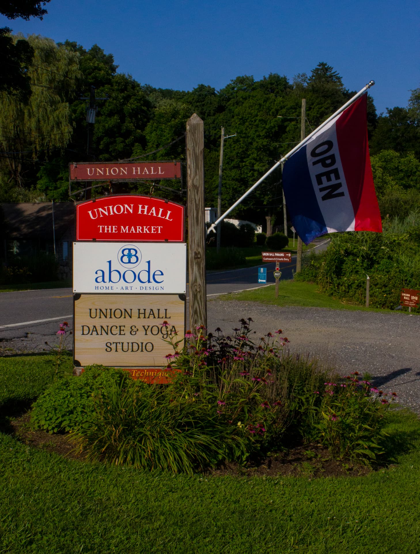 Union Hall and The Market roadside sign with an open flag in North Salem