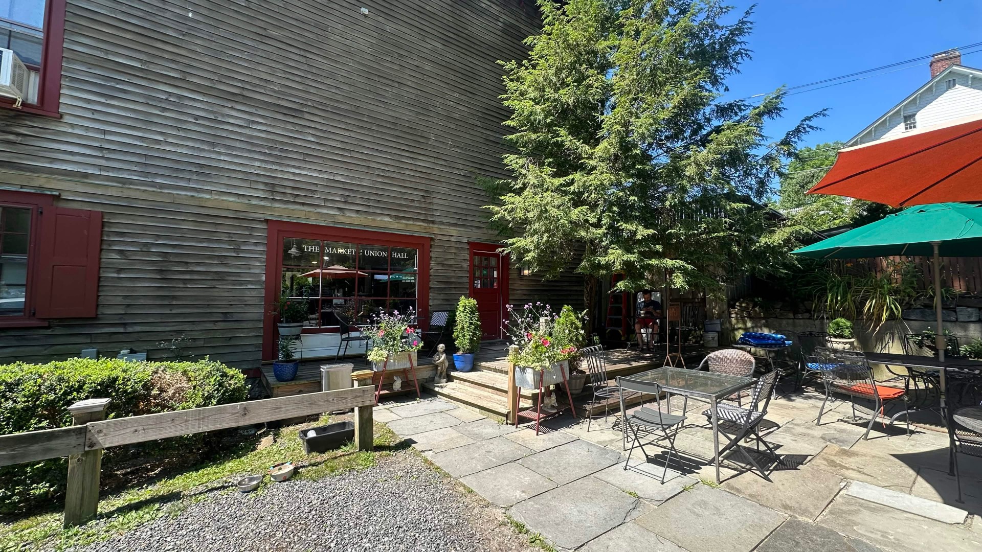 Outdoor patio and red entrance at The Market at Union Hall in North Salem